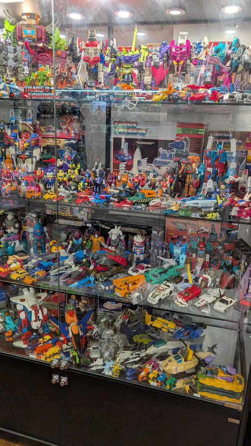 Transformers G1 shelves packed with vintage figures
